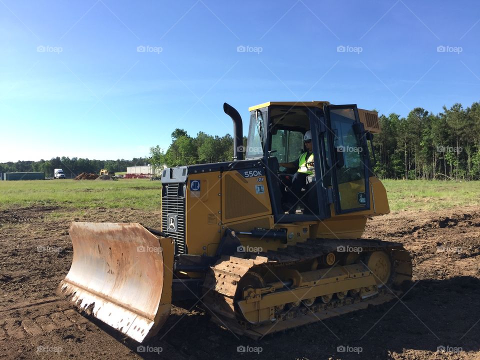Bulldozer on the grass field