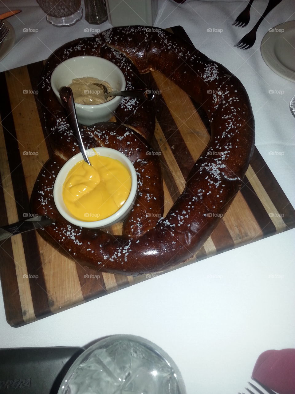 pretzel with mustard and cheese