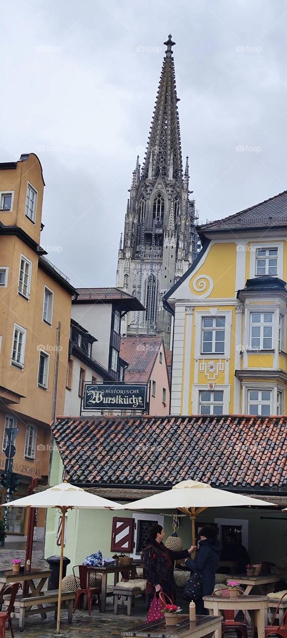A view over rooftops in “Regensburg”, Germany features houses and businesses from as far back as the year 800. The “Historische Wurstküche”, the “Historical Sausage Kitchen” still serves food here today. 2023. Hypnotic Productions