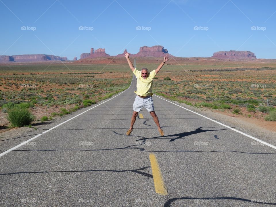 Senior man on highway at Grand Canyon, Utah