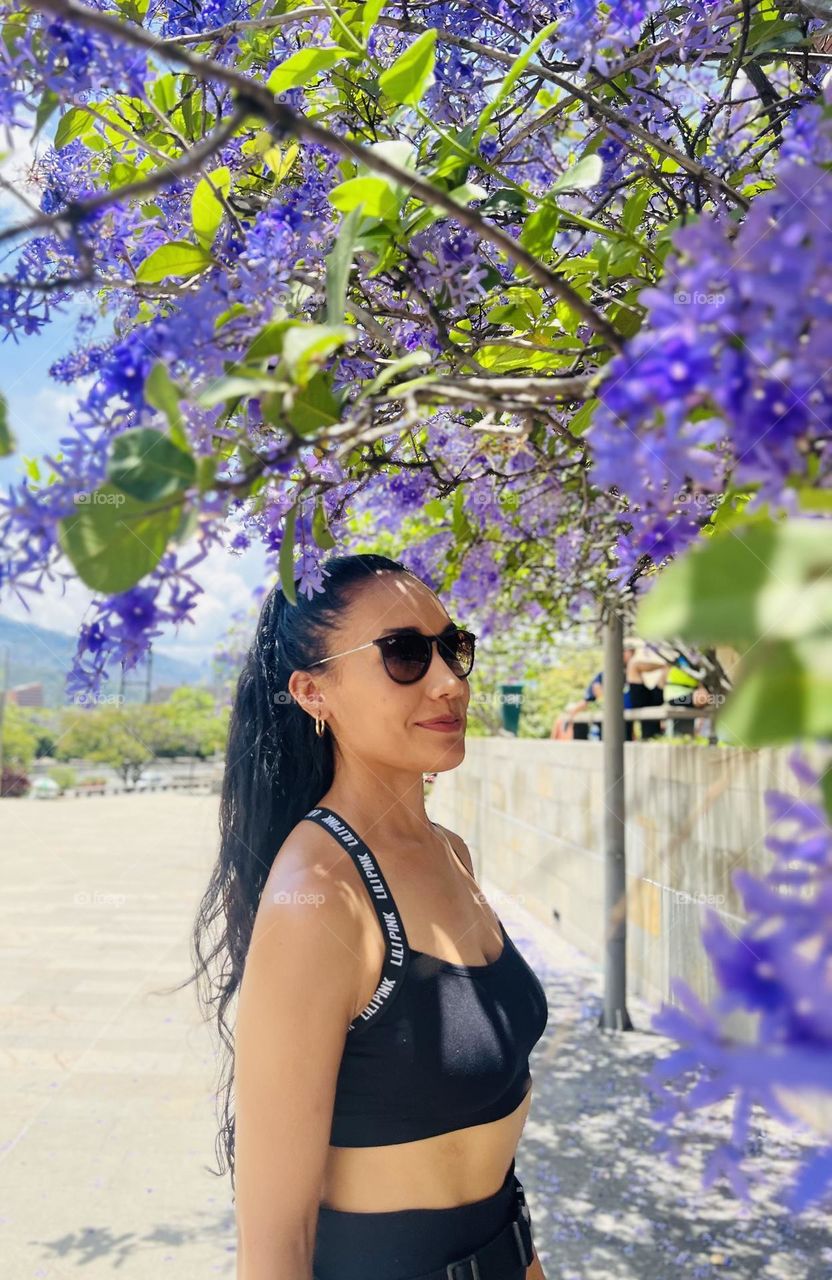 A woman with purple flowers