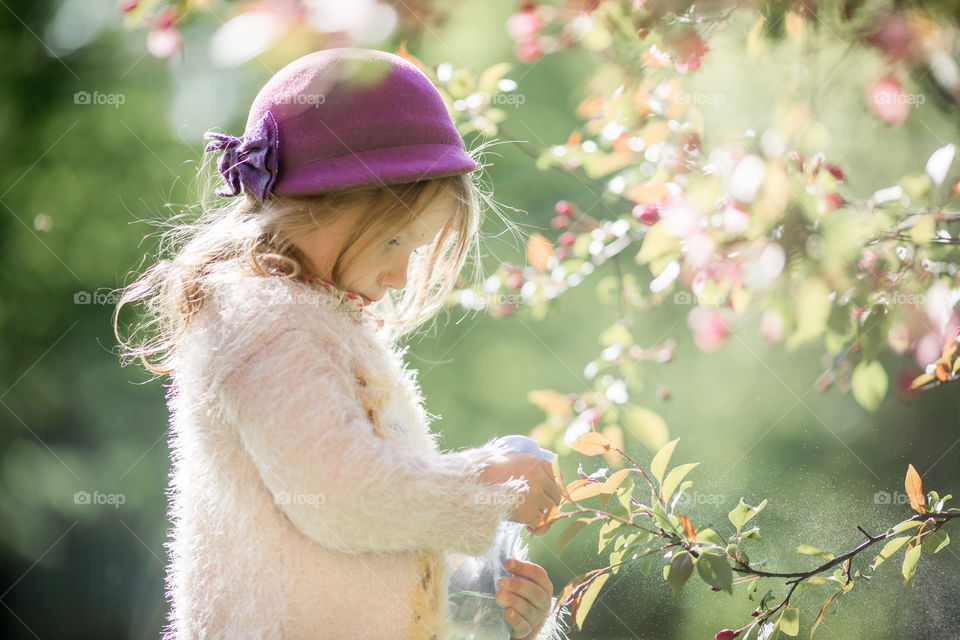 Cute Little girl in a blossom park