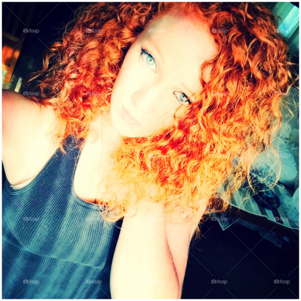 Natural redhead with fire curly hair