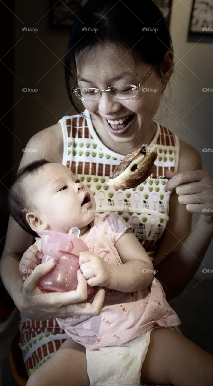 Mum and baby enjoying pastry