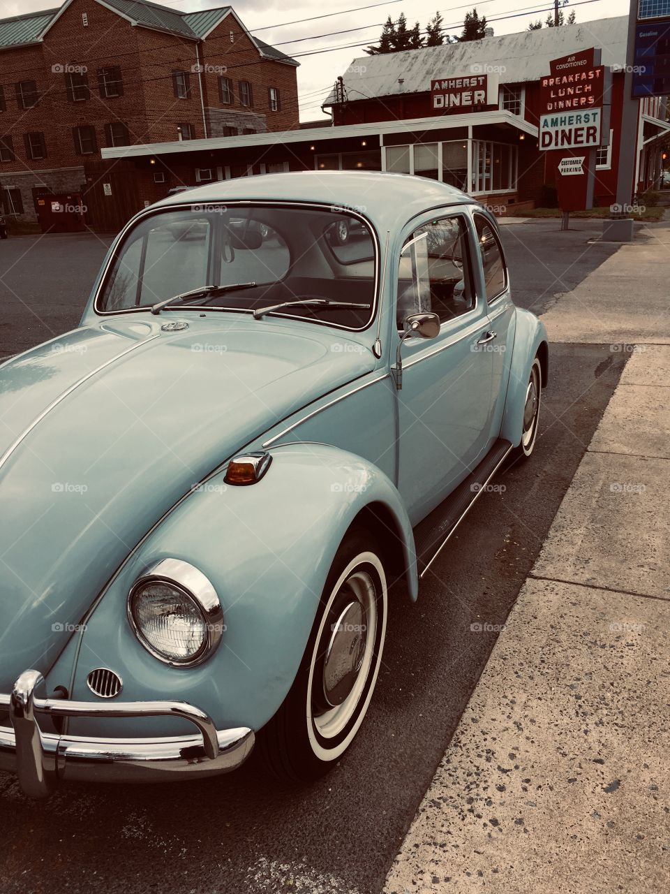 I saw this Volkswagen Beetle bug on the side of the road and had to stop and take a picture. It is just like the one we had when I was little. The diner  and sign in the background made this picture look quite vintage.