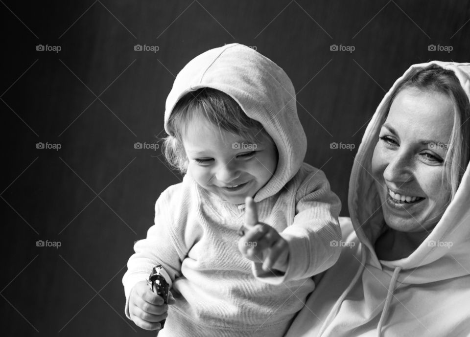 beautiful curly-haired boy smiles and rejoices