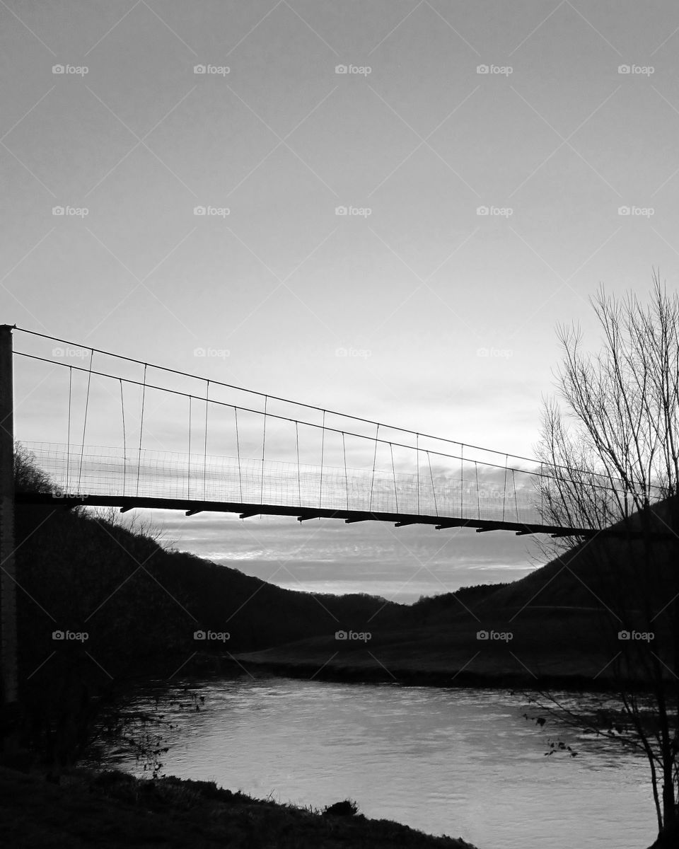River Swinging Bridge. A black & white shot of a swinging bridge along the Clinch River in Virginia. 