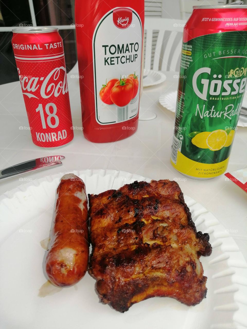 Grill gives in family. Austrian sausages