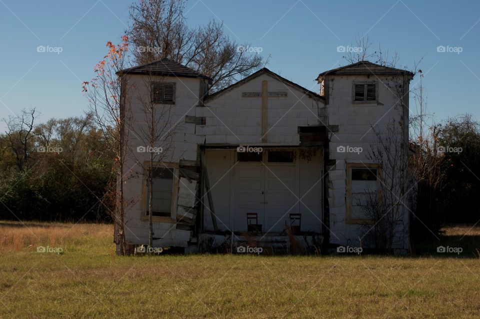 Abandon church building . An abandoned church in a big field in Texas.  