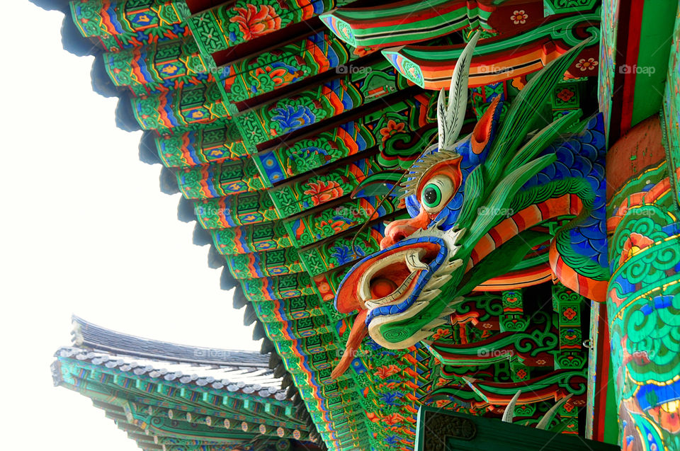 a green dragon decoration on a Buddhist temple in korea