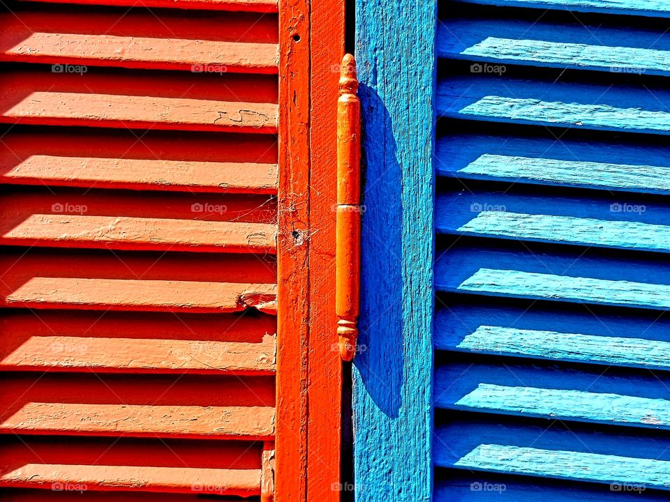 red and blue colourful window shutters