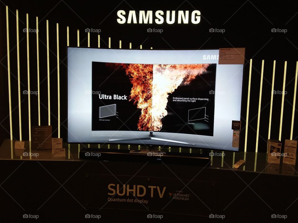 Samsung Quantum dot technology television with Dolby Atmos cinematic soundbar featuring ultra black technology 4K UHD