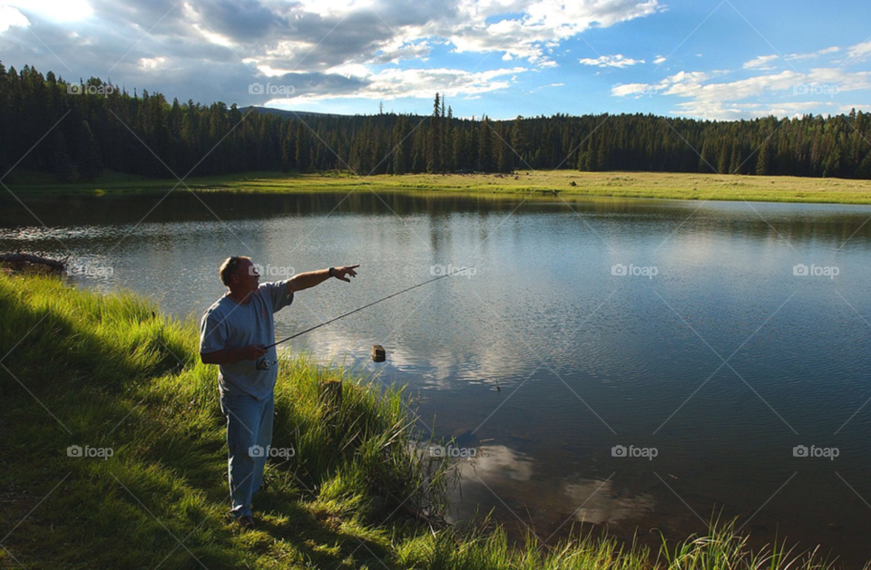 fisherman at a high mountain lake. fisherman at alpine lake. fishing. fish. arizona by arizphotog