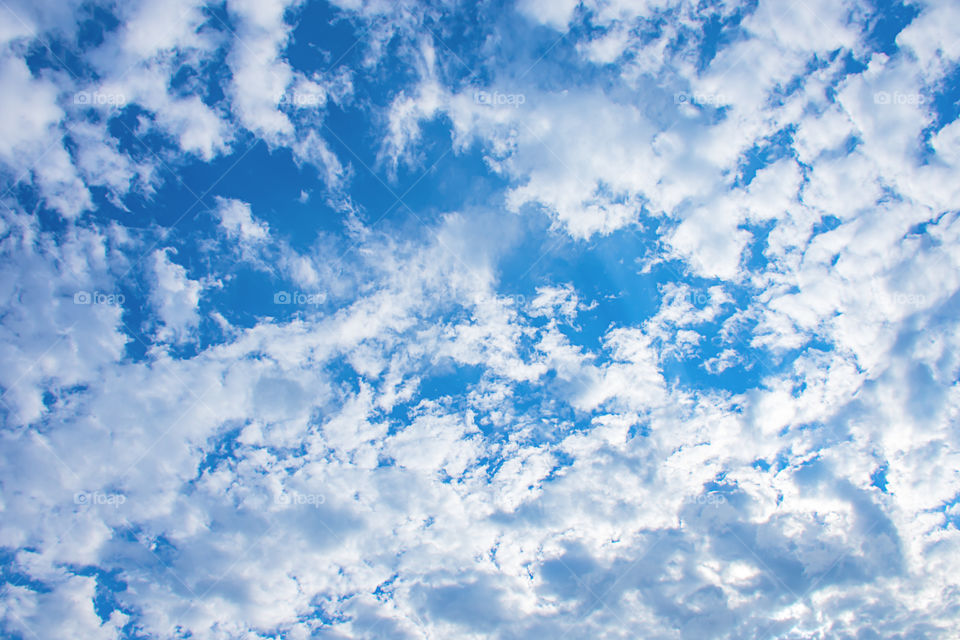 The beauty of the sky with clouds and the sun.