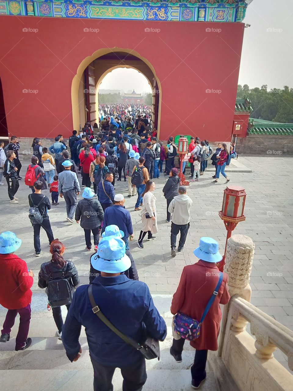 people entering and exit from Red wall Pagoda inside Temple of Heaven Beijing China