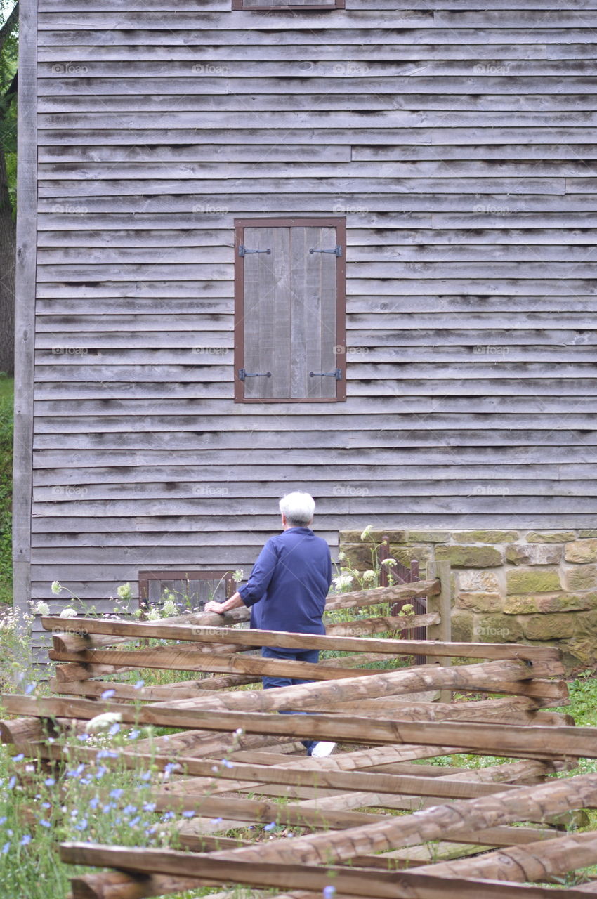 Looking at the old Mill and the flowers around it.