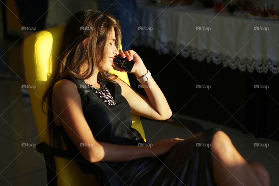 Beautiful girl talking on the phone (or not?) 😁

This is real live photo, not a posing ☺️