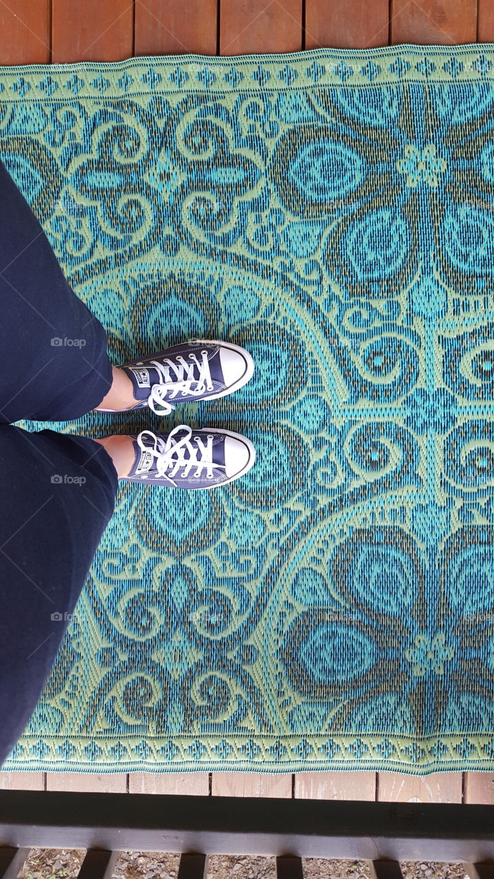 standing on woven rug