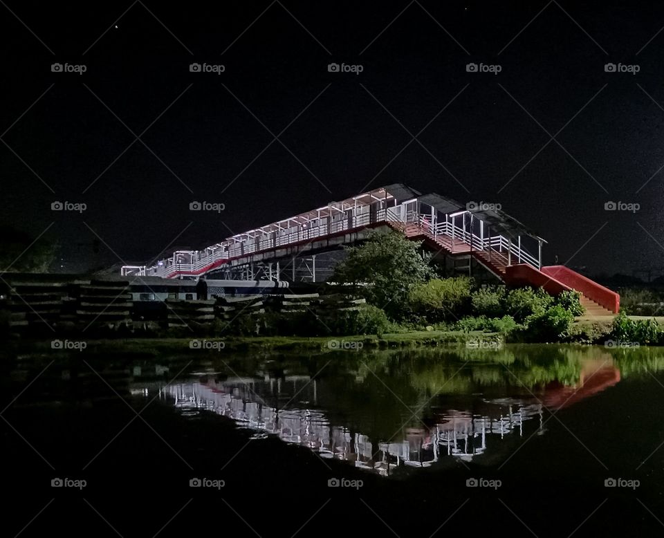 bridge shadow in lake water
