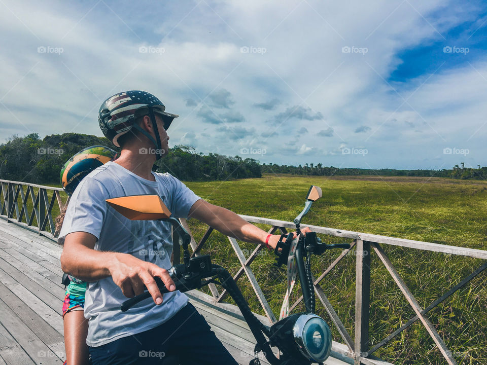 Father and daughter having fun riding a motorcycle