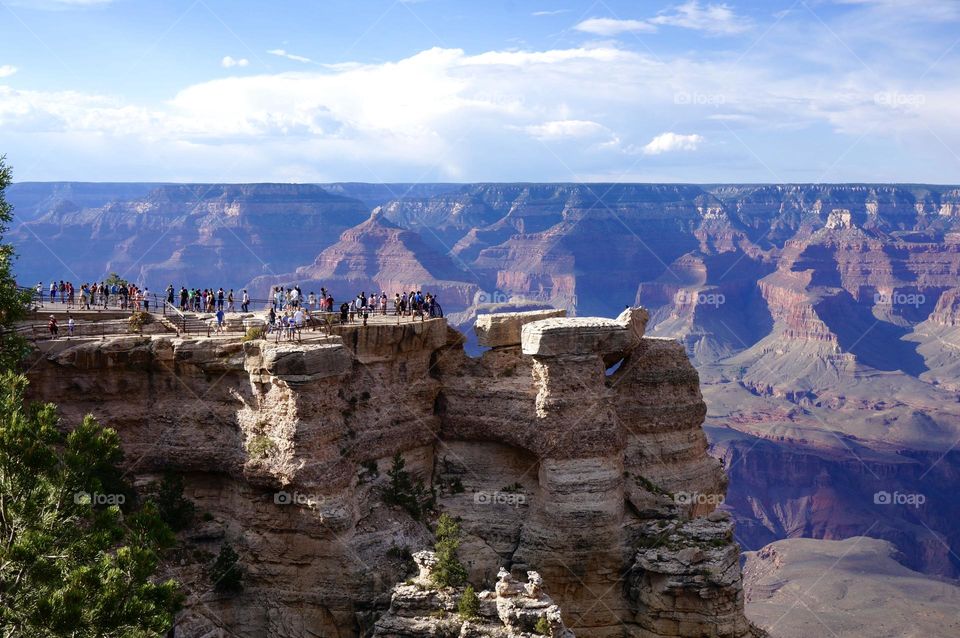 Tourists looking at the view of the Grand Canyon