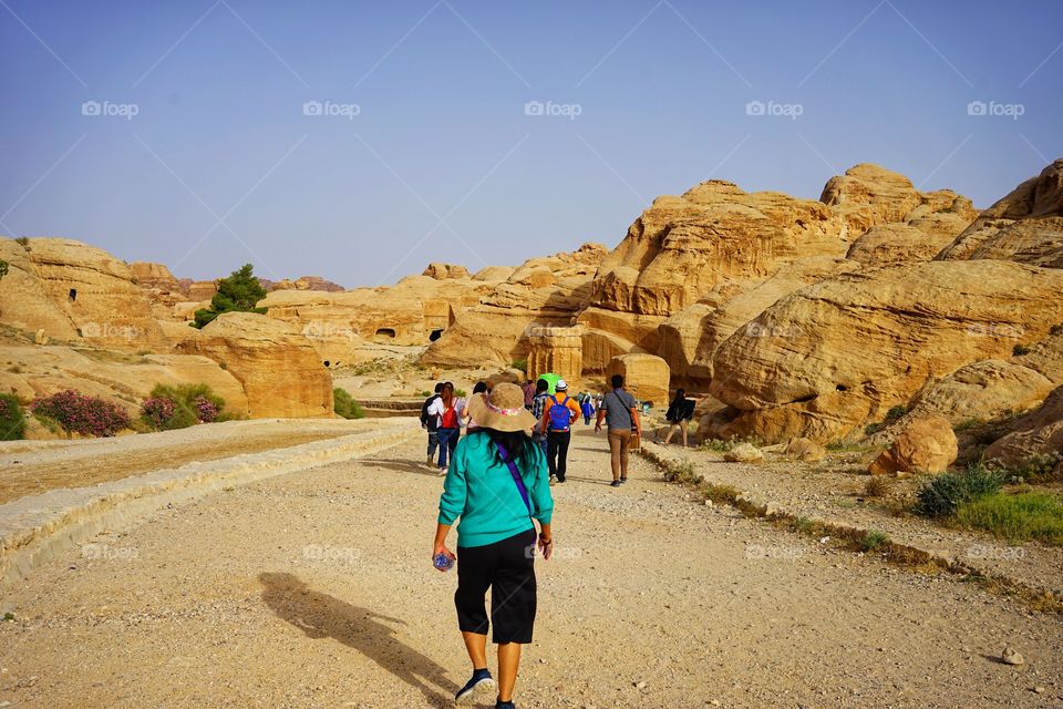 tourists walk in the way to Petra, Jordan