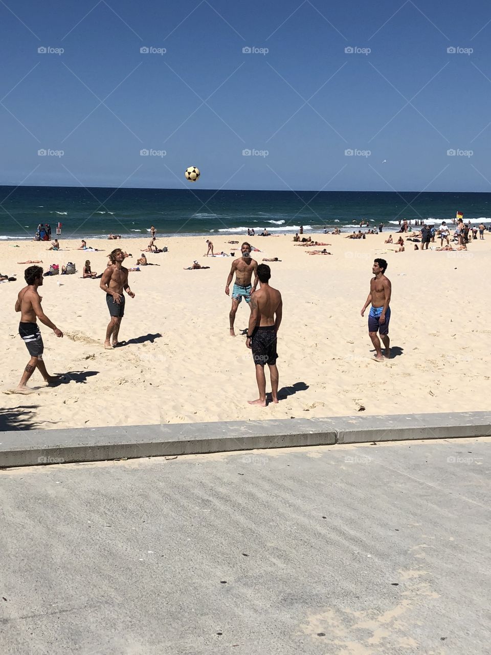 Playing ball on beach