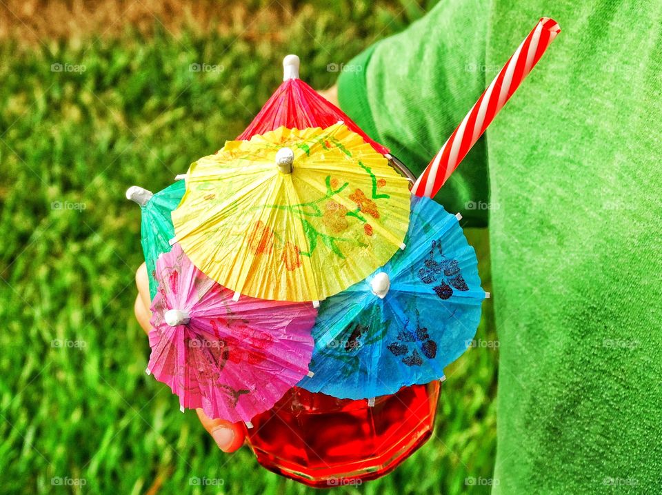 Colorful Cocktail. Tropical Concoction With Umbrellas In The Top
