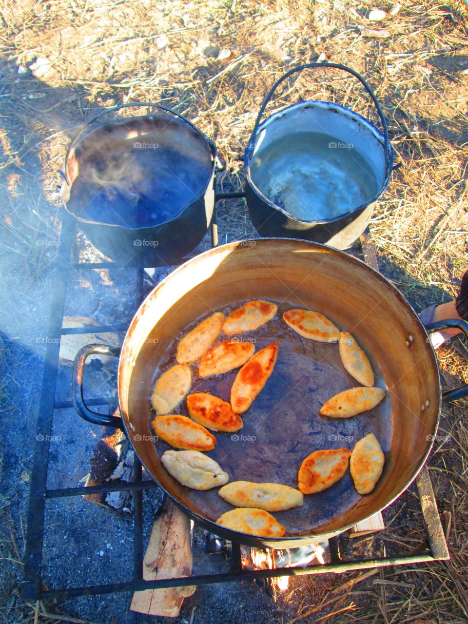 Cooking on the fire in tent camp