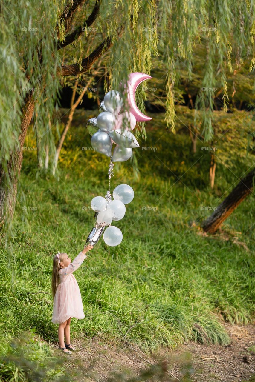 Little girl and hot air balloons 