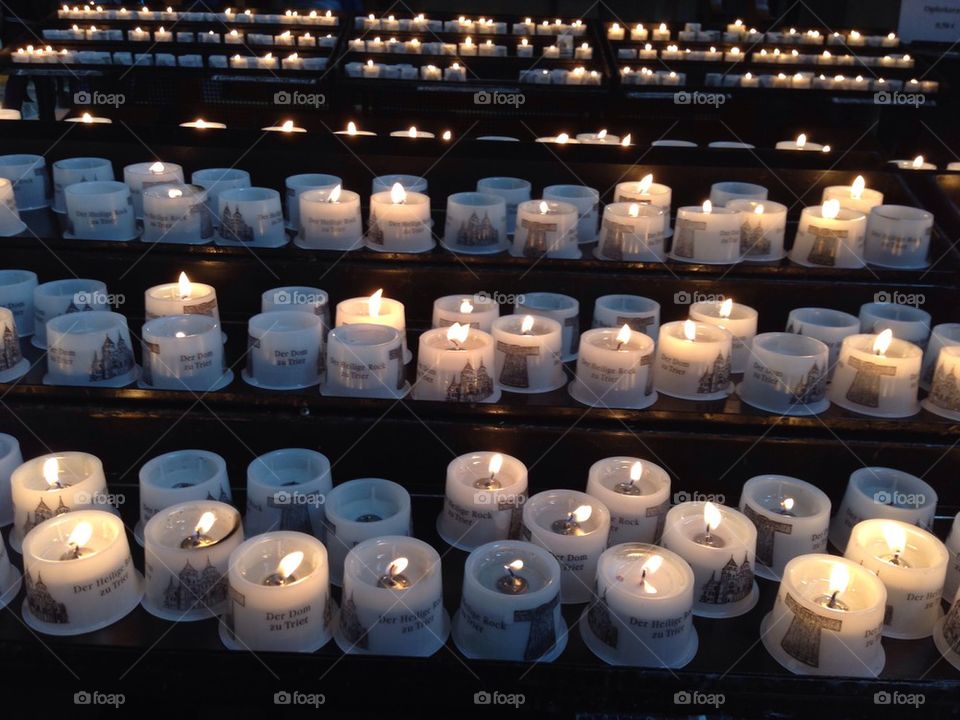 Candles in a cathedral/ church in trier , Germany 