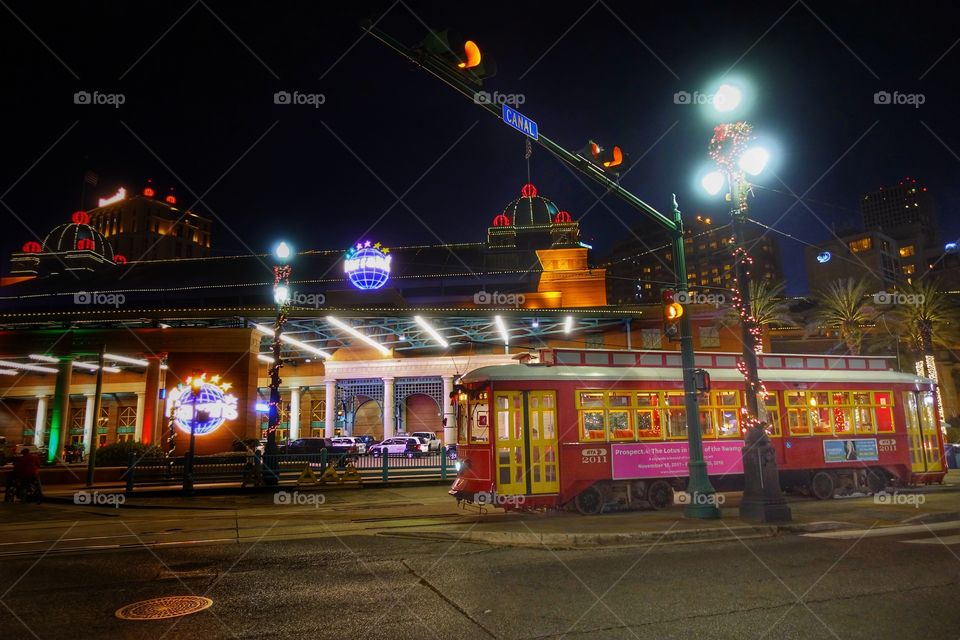 A retro-style tram waiting near Canal Street to pick up new passengers. One of the many night scenes at the French Quarter, New Orleans, Louisiana, USA.
