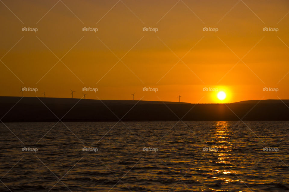 Golden sun rays at lake