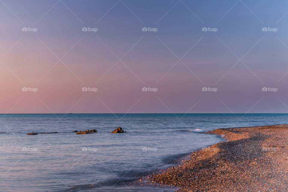 Sunrise at one point. Soft color sunrise at wind point in Racine Wisconsin