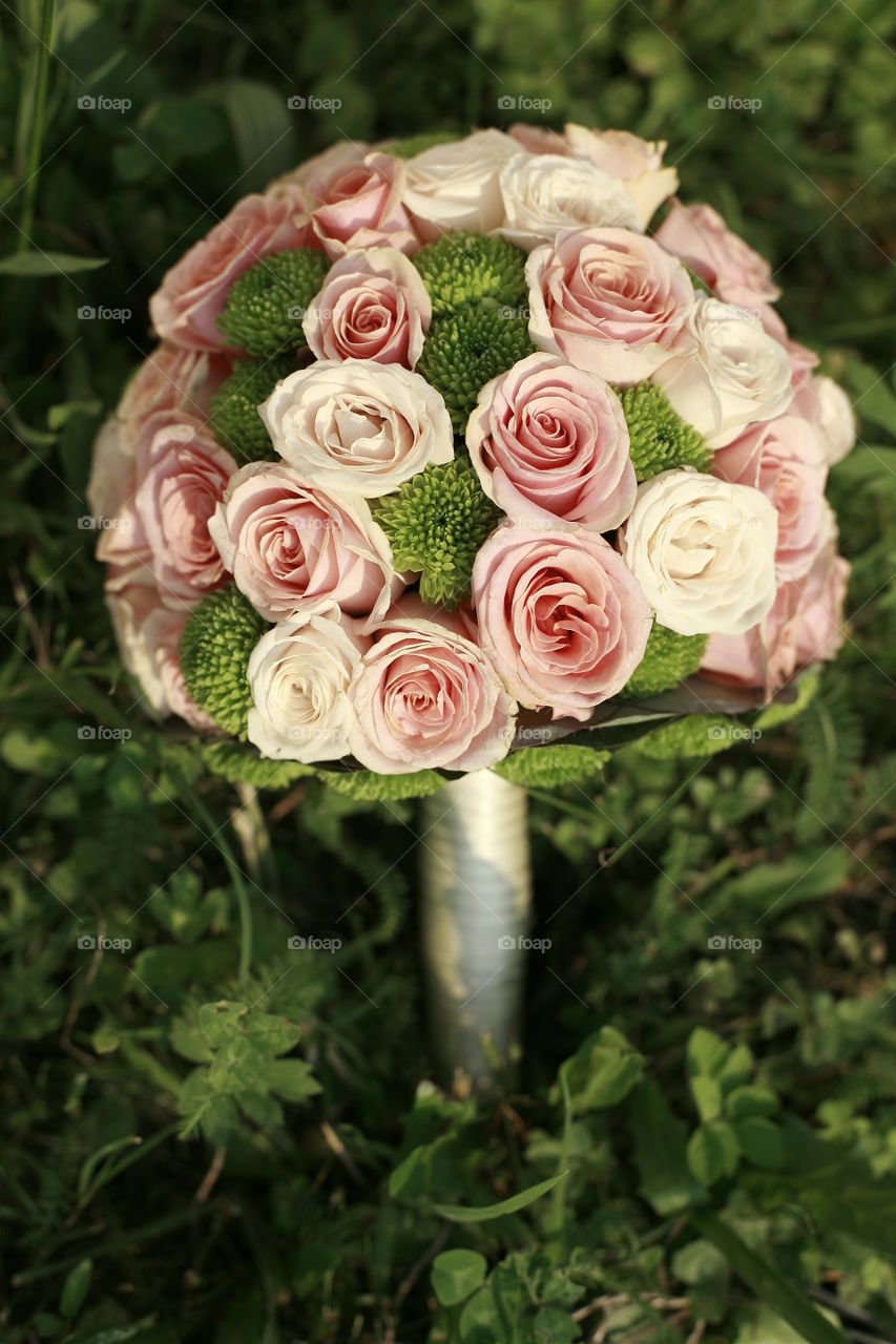 wedding bouquet. wedding bouquet in green grass background