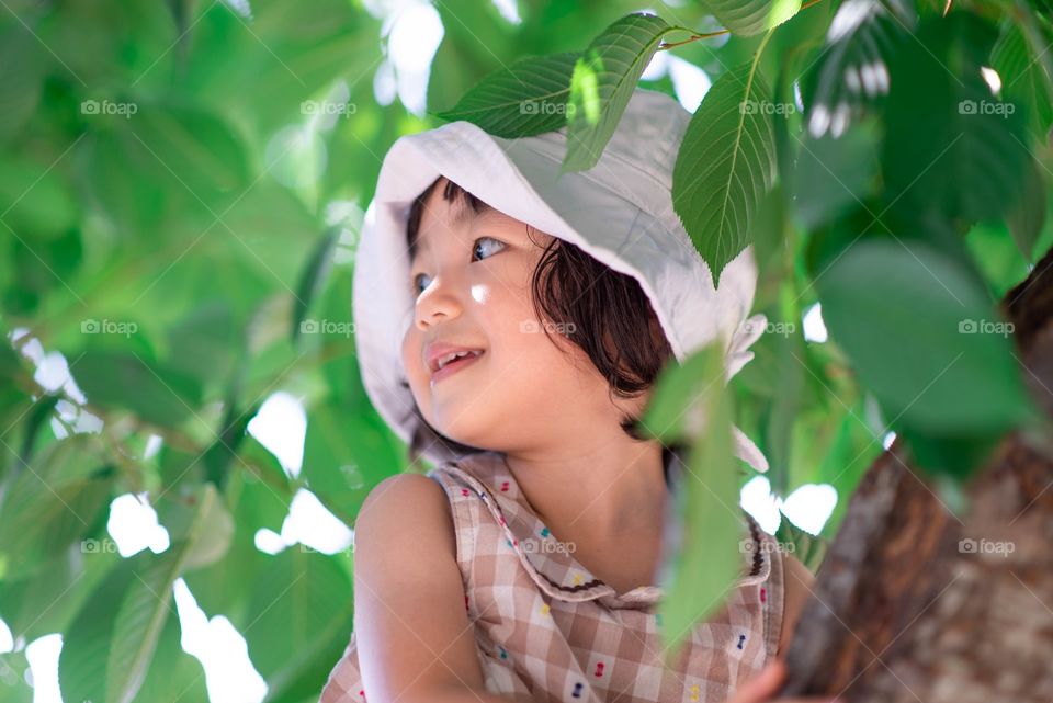 girl climbing a tree
