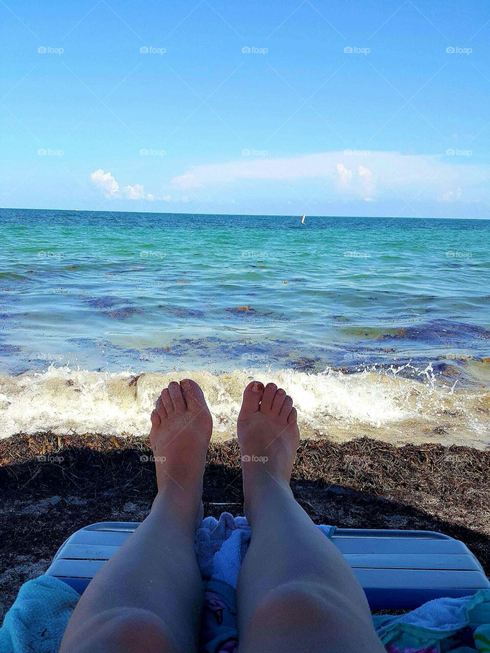 Feet near the Ocean. On vacation in Florida relaxing