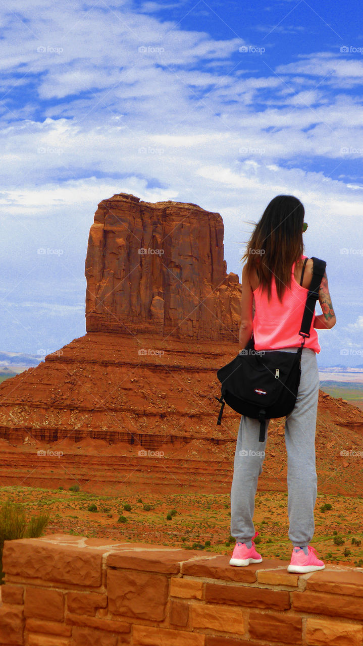 A woman is Looking the big monolith of the Monument valley tribal park,Utah