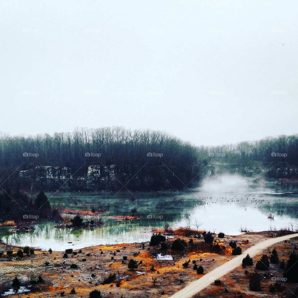 Fog over a quarry pond