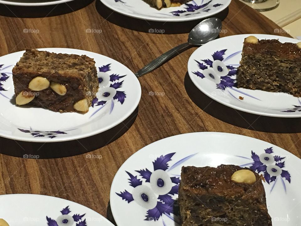 Serving up
Fruit nut cake, several servings on decorative plates