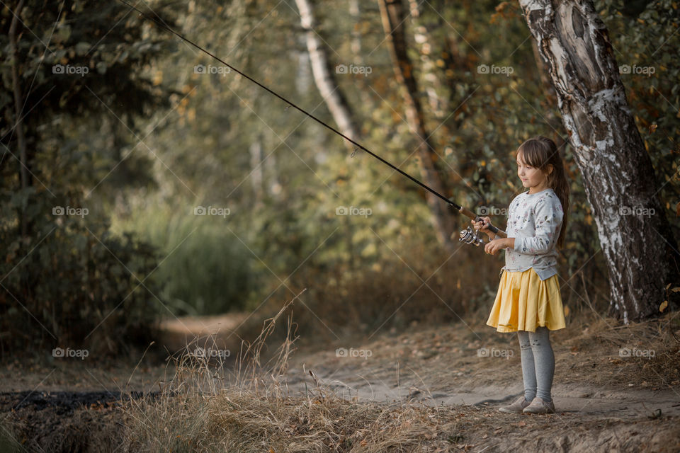 Little girl portrait at autumn day