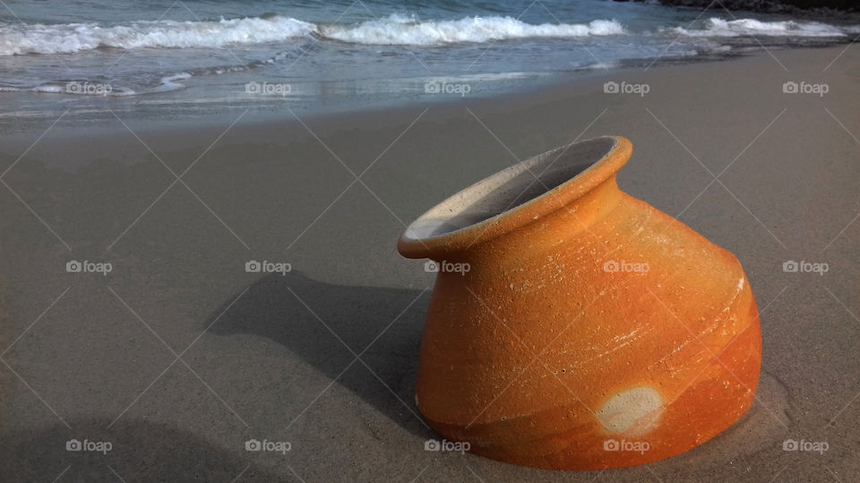 clay jar on the beach