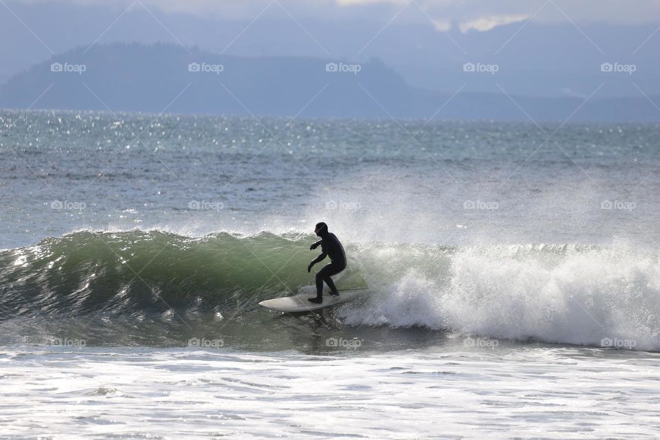 Surfer riding on wave