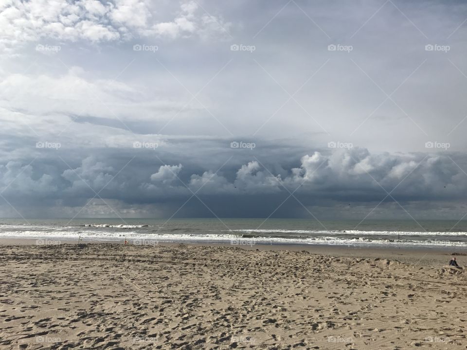 Stormy clouds above the sea at the beach 