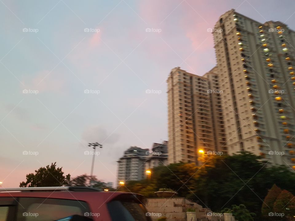 Blue and pink tone coloring evening sky behind the building