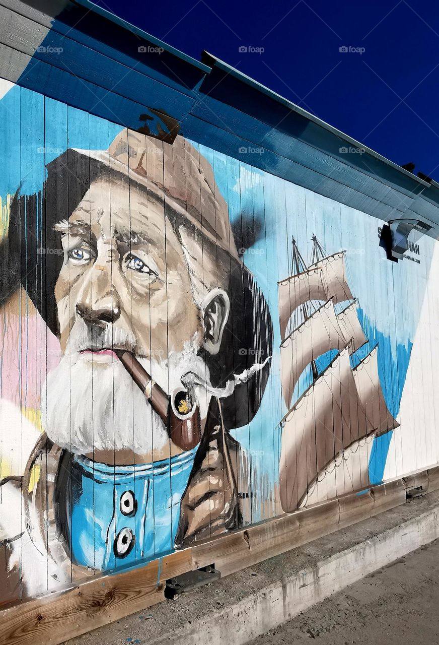 Street art - fisherman and a ship