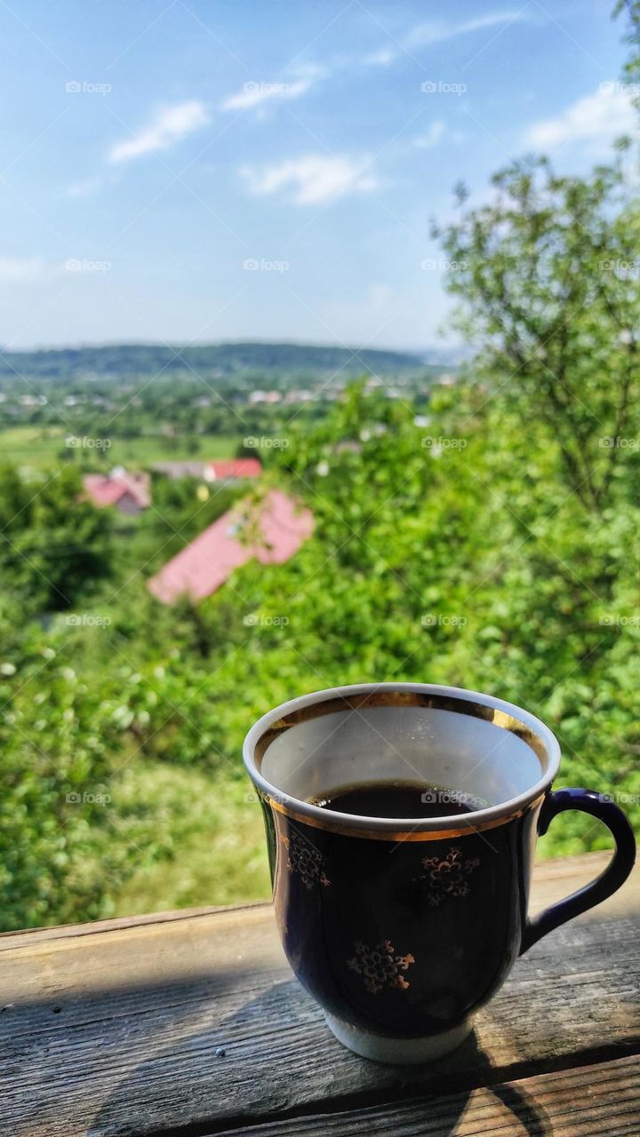 Hot coffee mug with city view