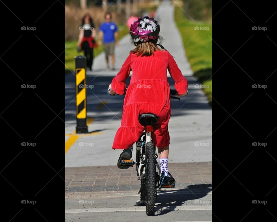 Little girl on bike path