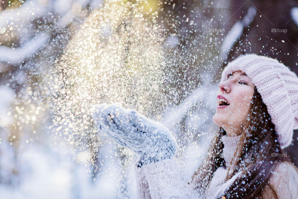 Woman in snowy forest 