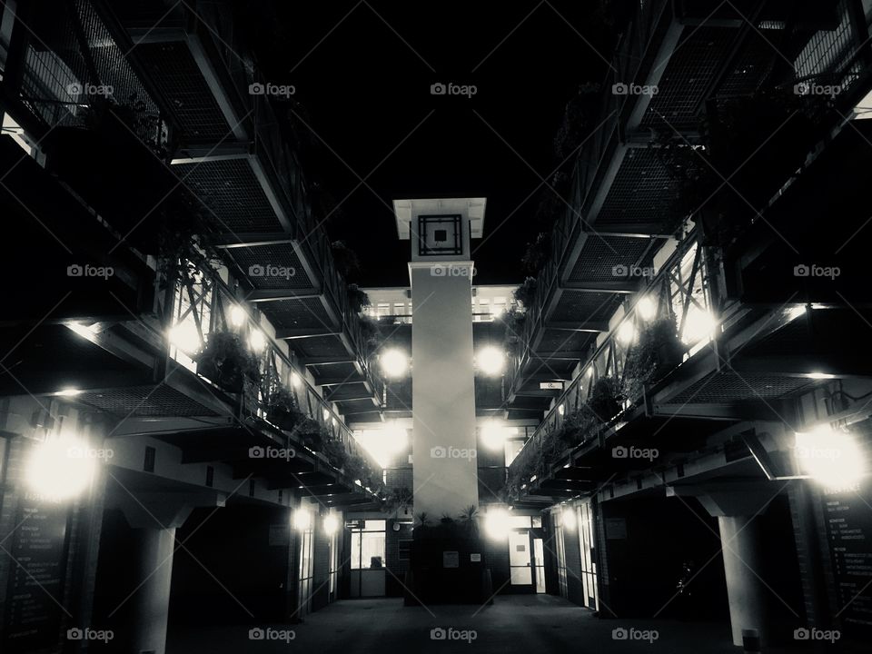 View into Baden Place off Crosby Row in Southwark London. Clock tower visible in centre. Shot in Autumn.